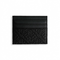 A high-resolution black leather Bugatti card holder with debossed 'Rick Ross The Boss' branding and card slots, centered on a pure white background.
