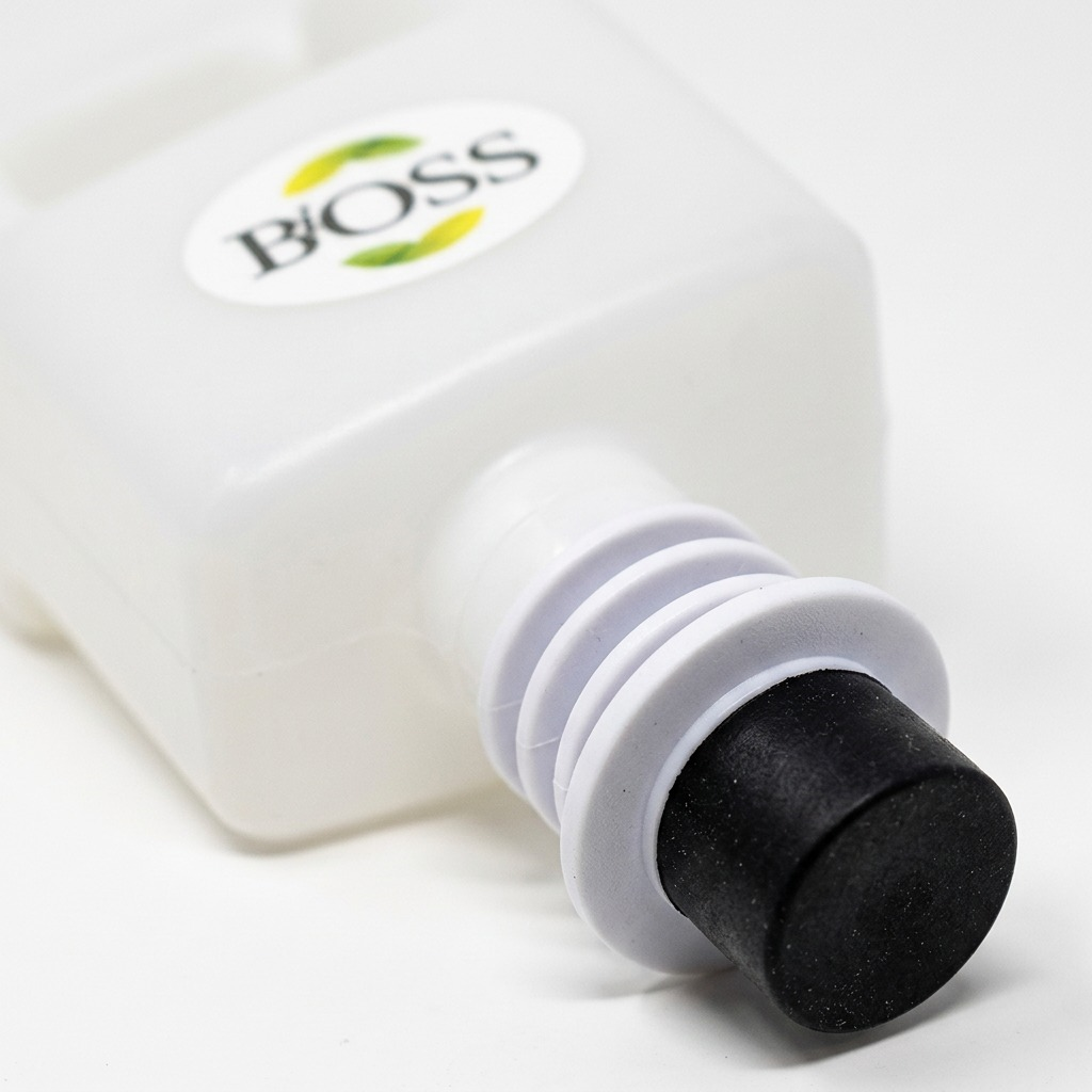 Macro detail of the BiOSS 850ml hand sanitizer refill pouch nozzle and dispenser connector.